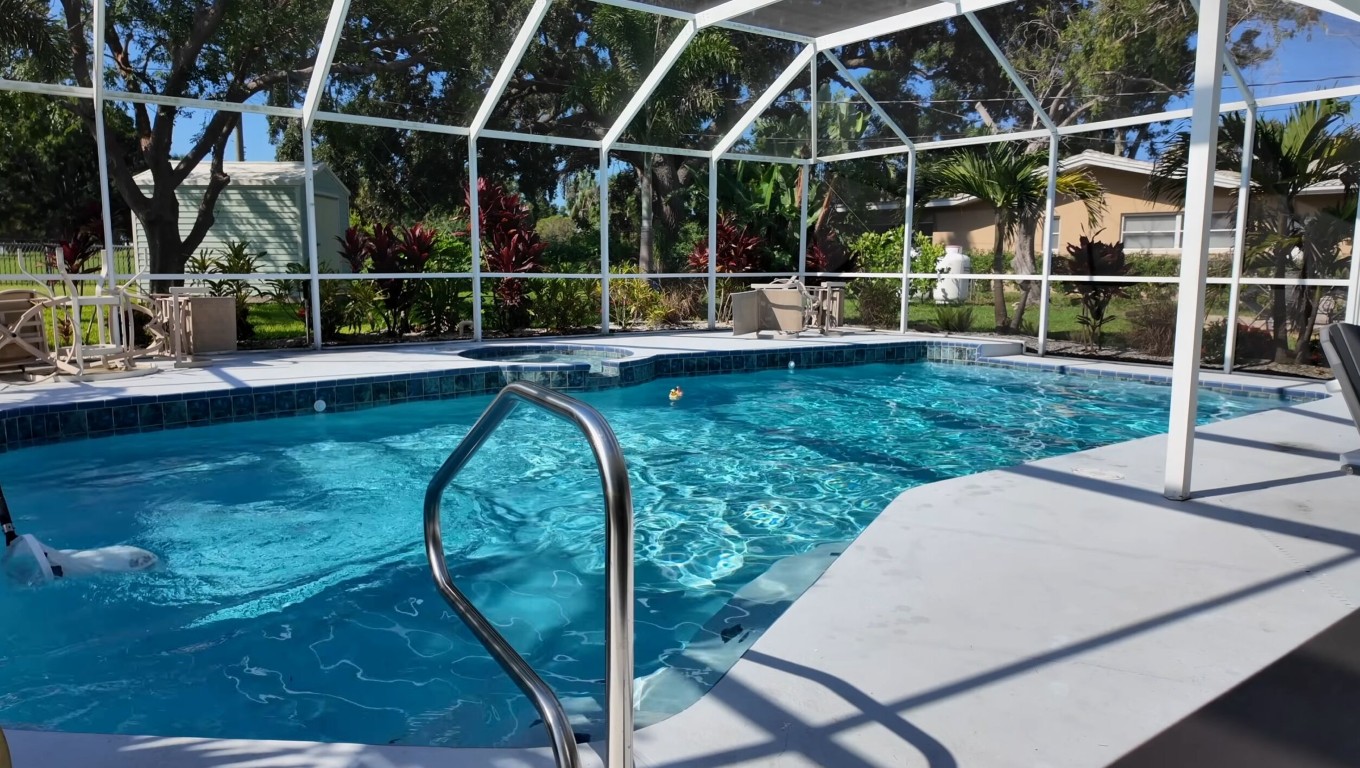 Well-maintained enclosed pool with professional care