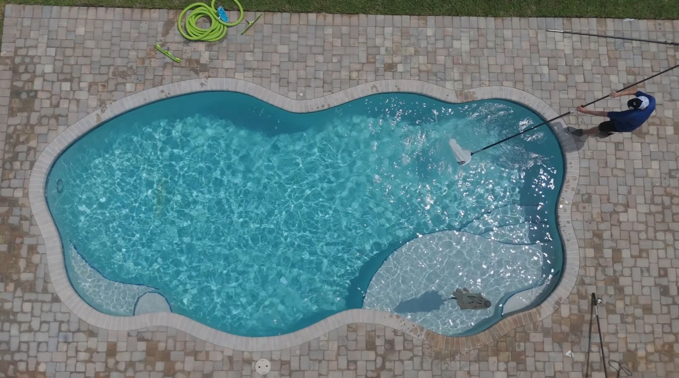 Aerial view of professional pool maintenance and filter service